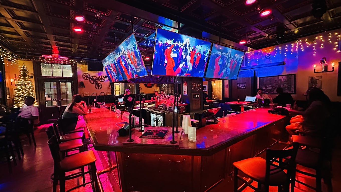 The Crossing bar at night with vibrant lighting